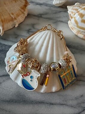 Gold Charm Bracelet with Blue & White Enamel Accents